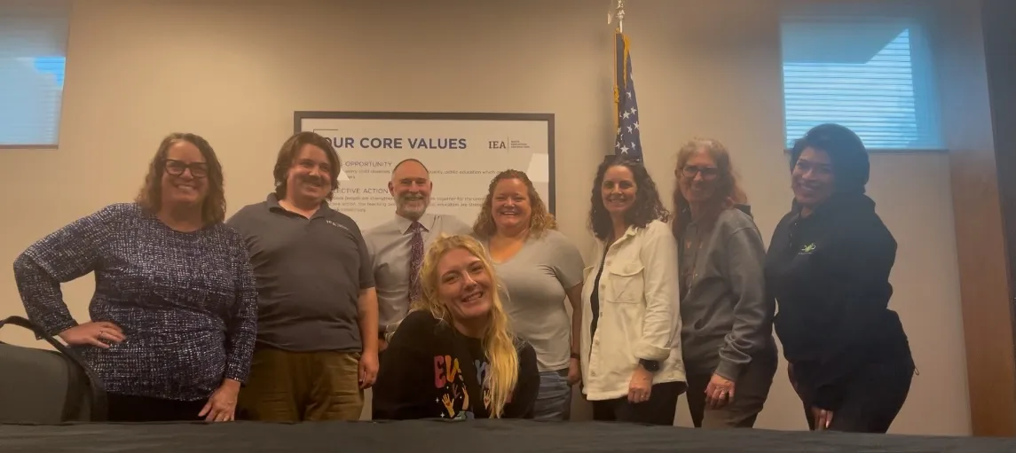 A group of people smile at the camera