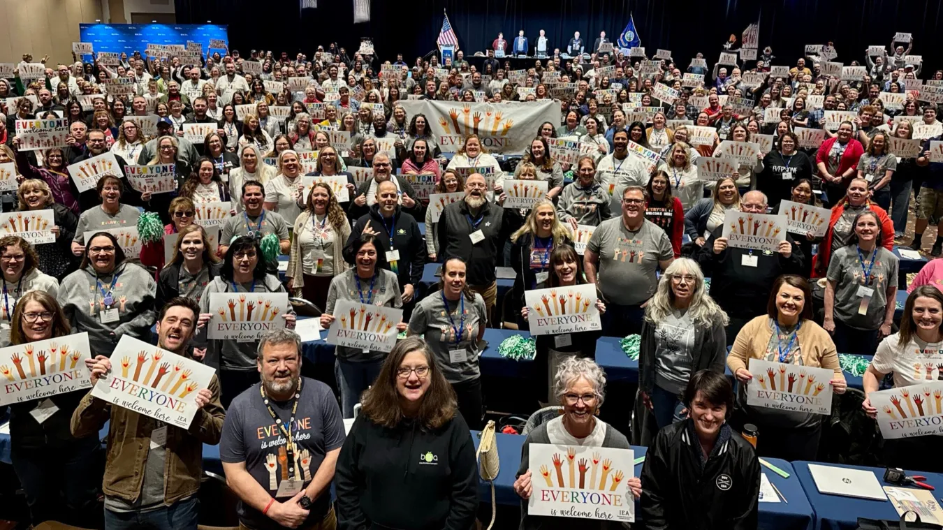 group phote everyone is welcome here signs IEA DA