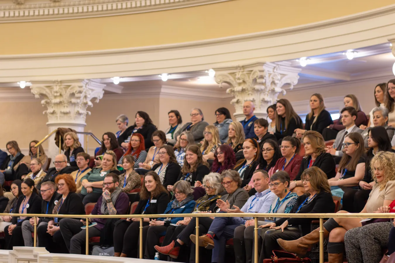 A group of people in a gallery in the Idaho Senate chambers