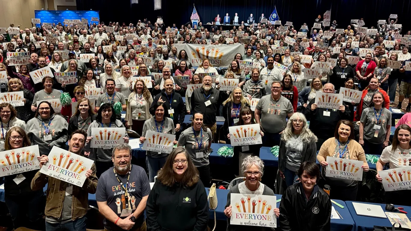 group phote everyone is welcome here signs IEA DA