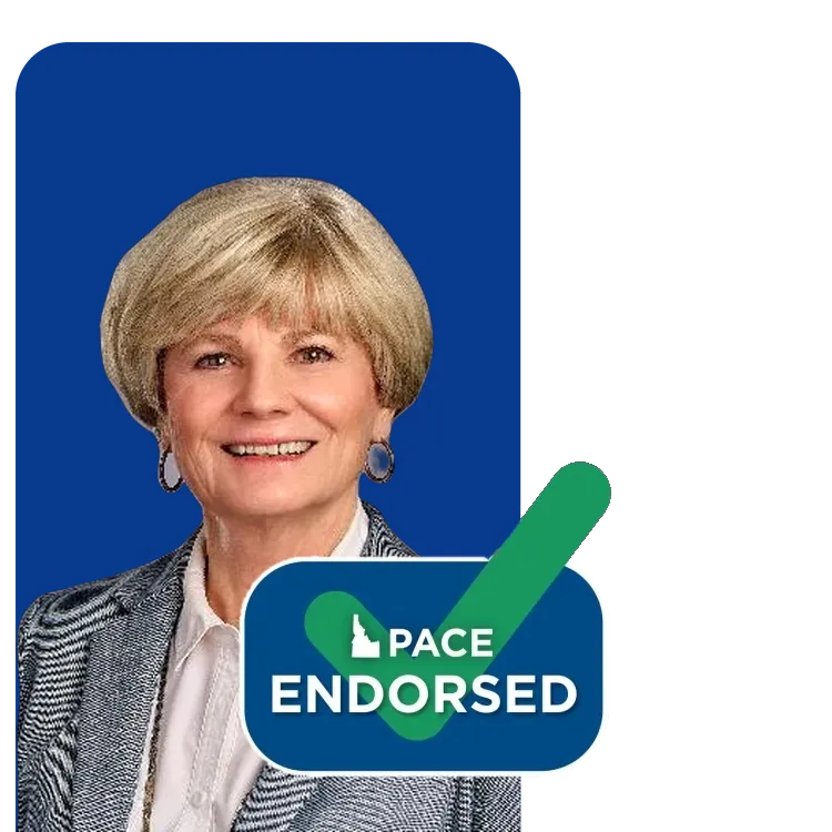 A smiling woman with short blonde hair
