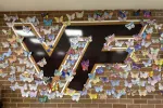 A picture of the Vallivue logo surrounded by paper butterflies