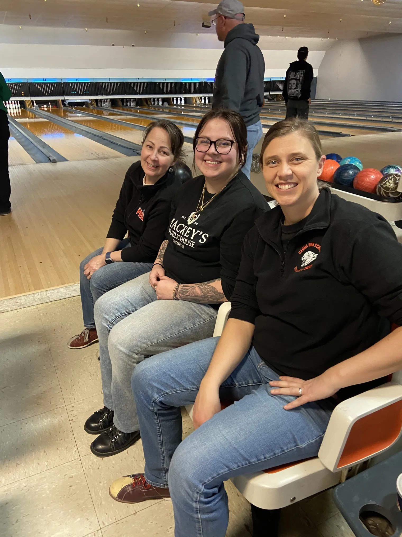 IEA members seated at a bowling alley