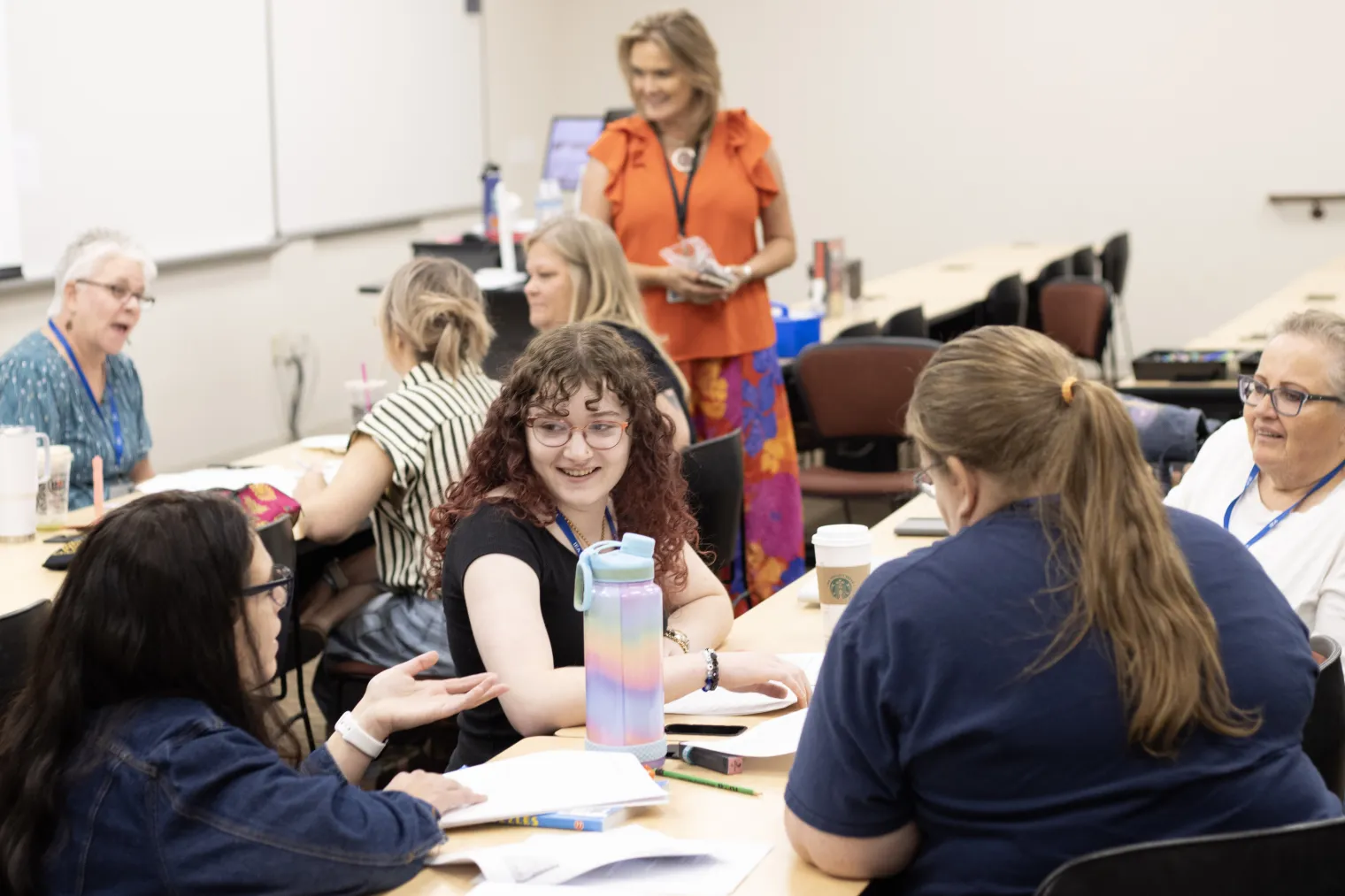 A group of women engage in discussion
