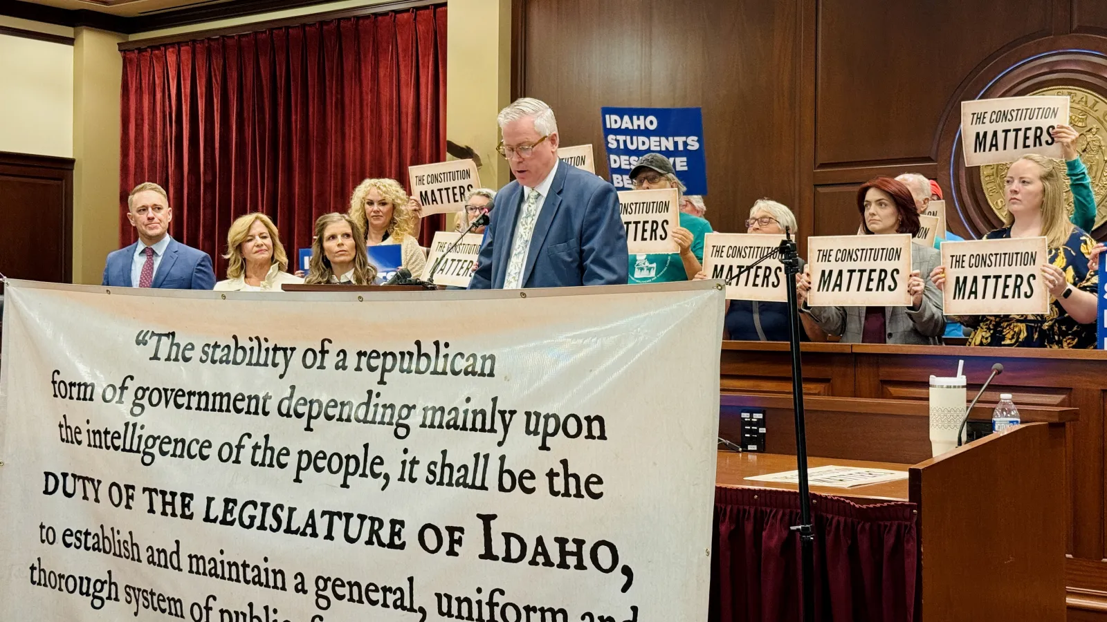 IEA Executive Director speaks at podium at a press conference. 