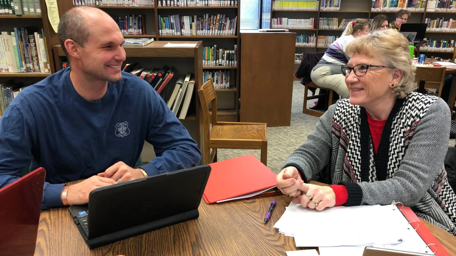 veteran educator mentoring younger educator