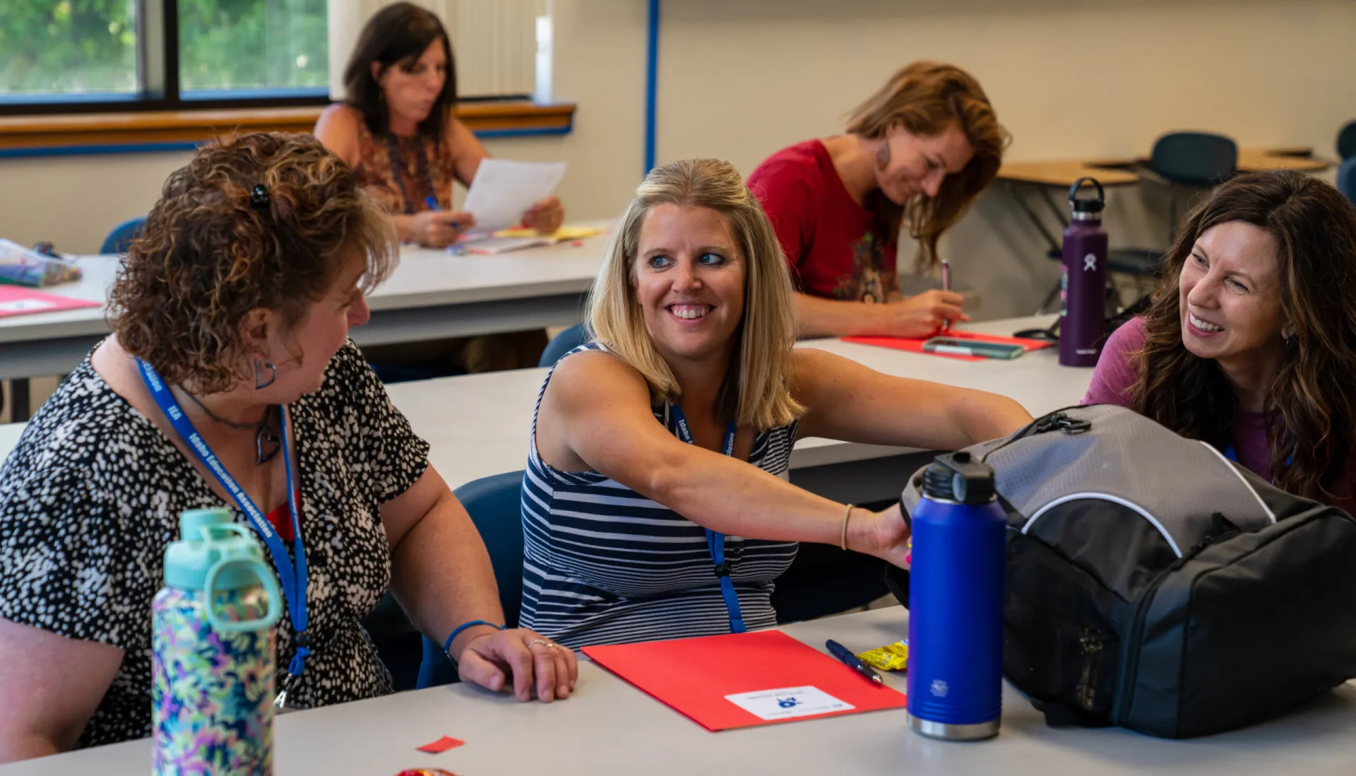 Women educators talking in classroom