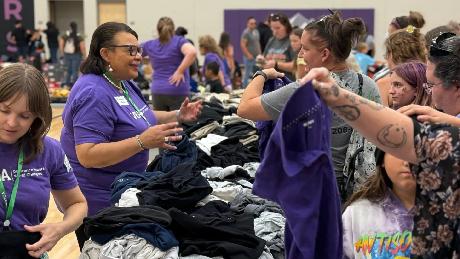 Princess Moss, vice president of NEA, pitches in at the VEA's annual Back to School Fair last Saturday.