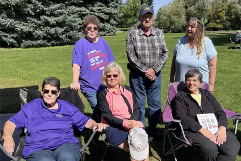 A group of retired IEA members enjoys a sunny day. 
