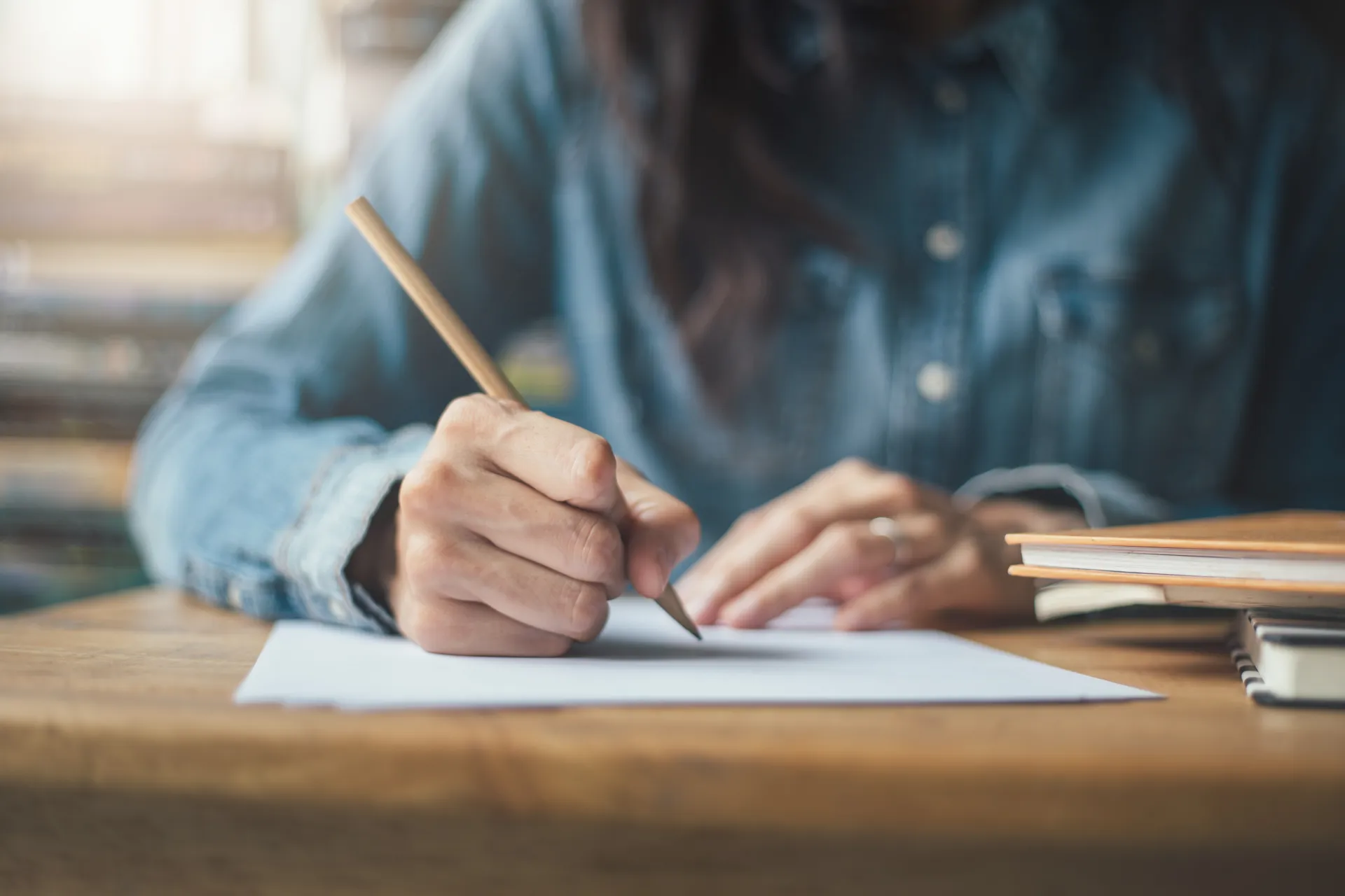 A detail photo of a woman taking an exam