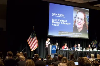A woman accepts an award