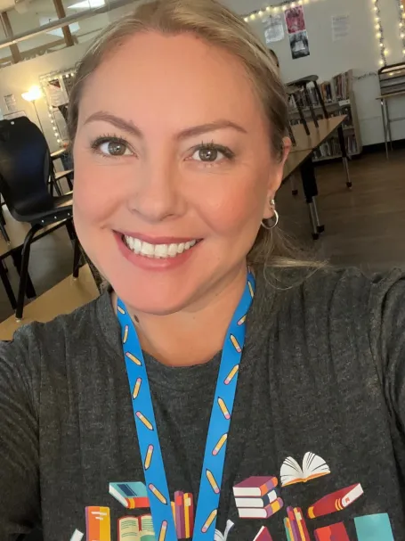 A woman smiles at the camera