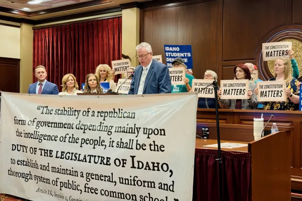 IEA Executive Director speaks at podium at a press conference. 
