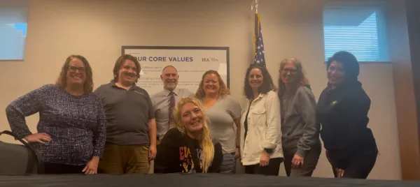 A group of people smile at the camera