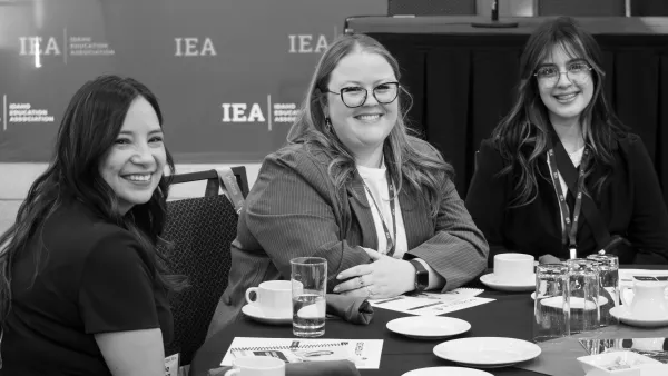 IEA members sit at a table at Lobby Day