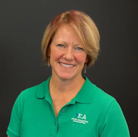 A woman wearing a green shirt