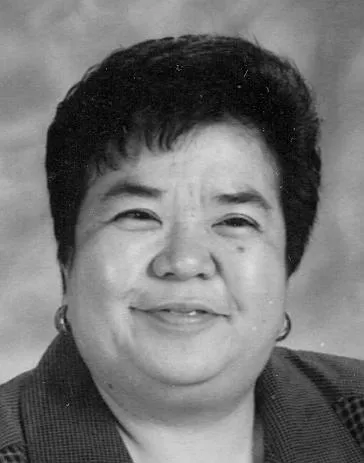 A black-and-white photo of a woman with short dark hair