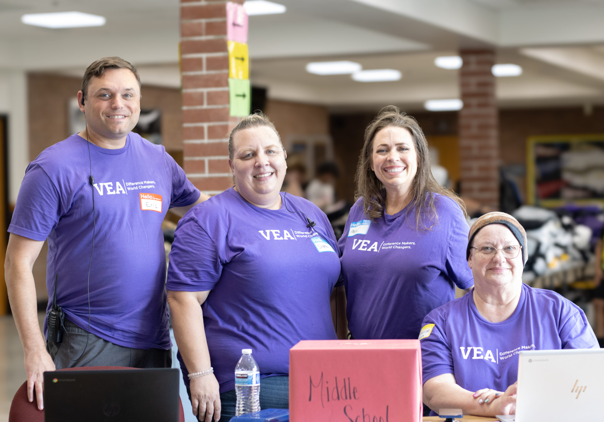 Local union members pose in purple shirts.